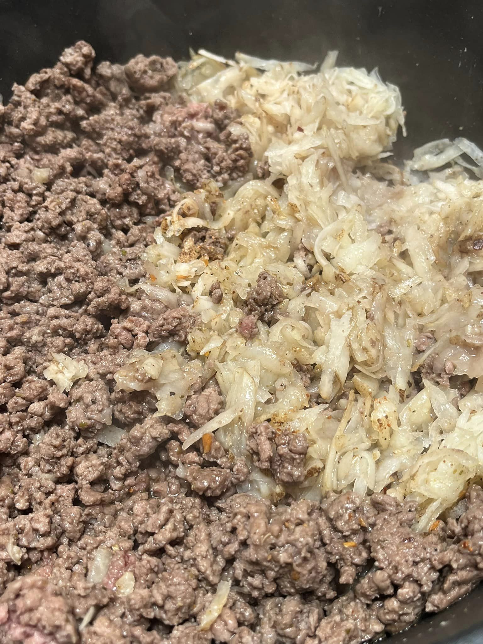 Ground beef and one large shredded potato, diced onion and garlic, salt and pepper